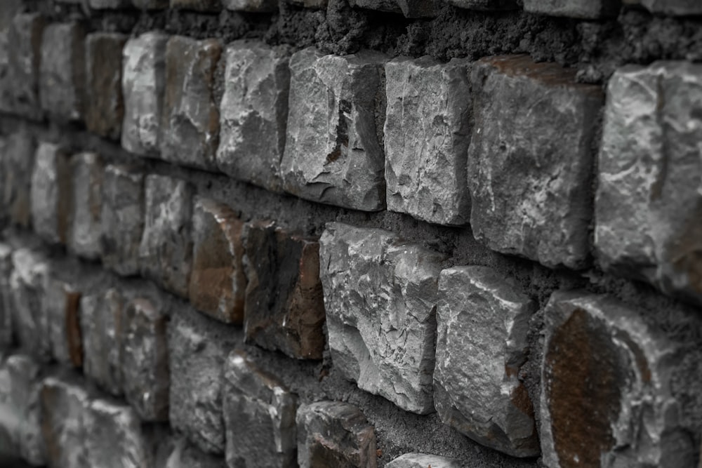 a close up of a brick wall made of rocks