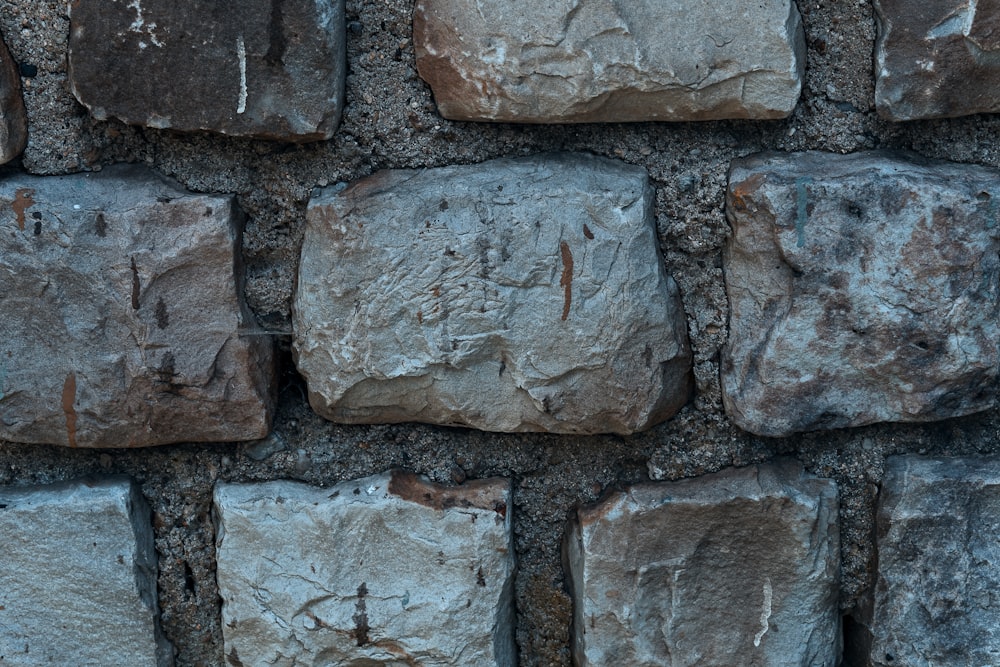 a close up of a wall made of rocks