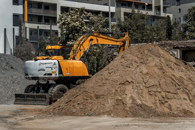 a large pile of dirt next to a building