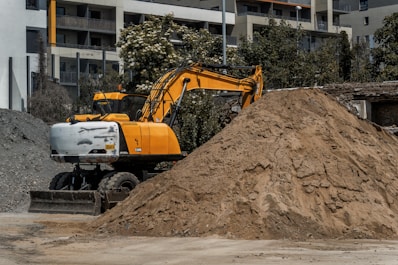 a large pile of dirt next to a building