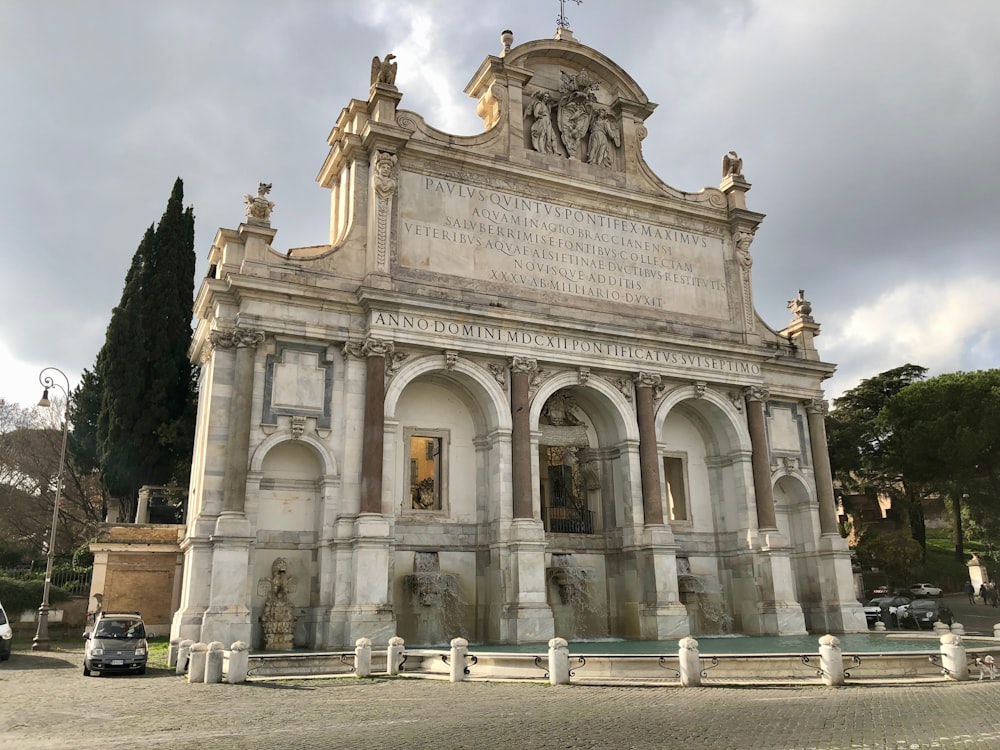 a large building with a statue on top of it