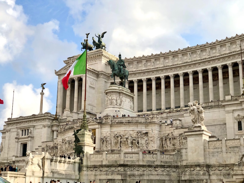 a large building with a [UNK] of a horse on top of it