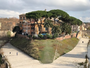 a large building with trees on the top of it