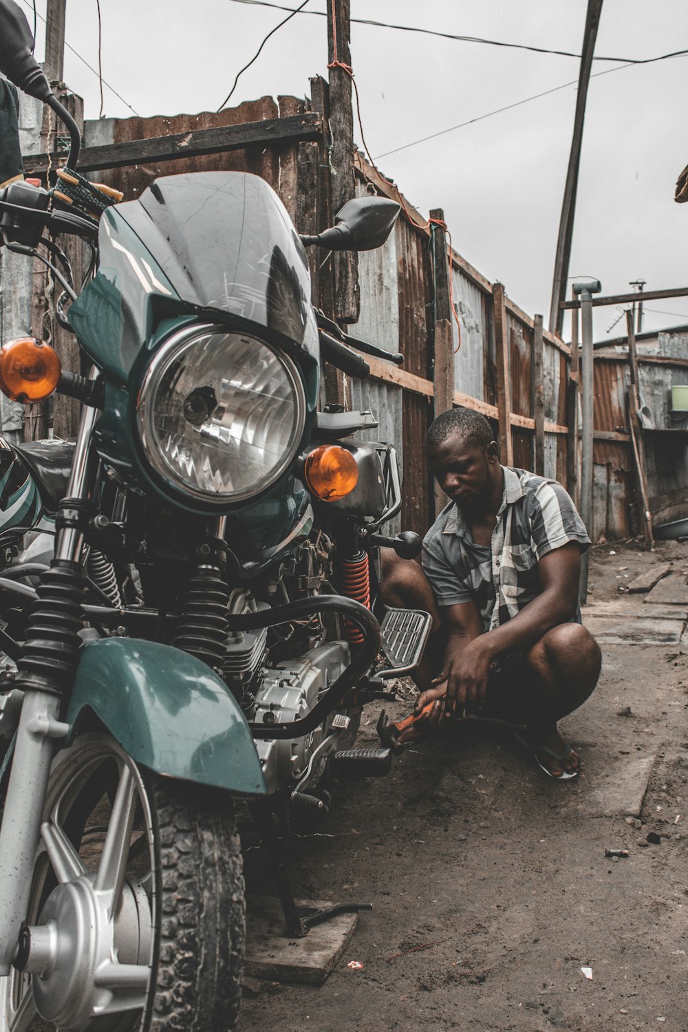 a man sitting on the ground next to a [UNK]