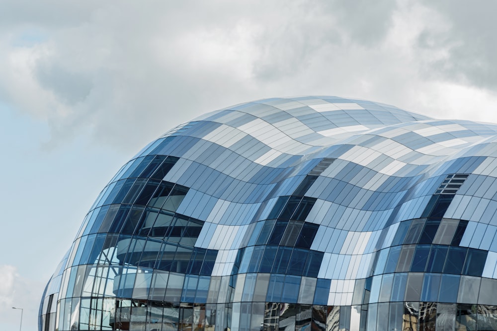 a large building with a curved glass facade