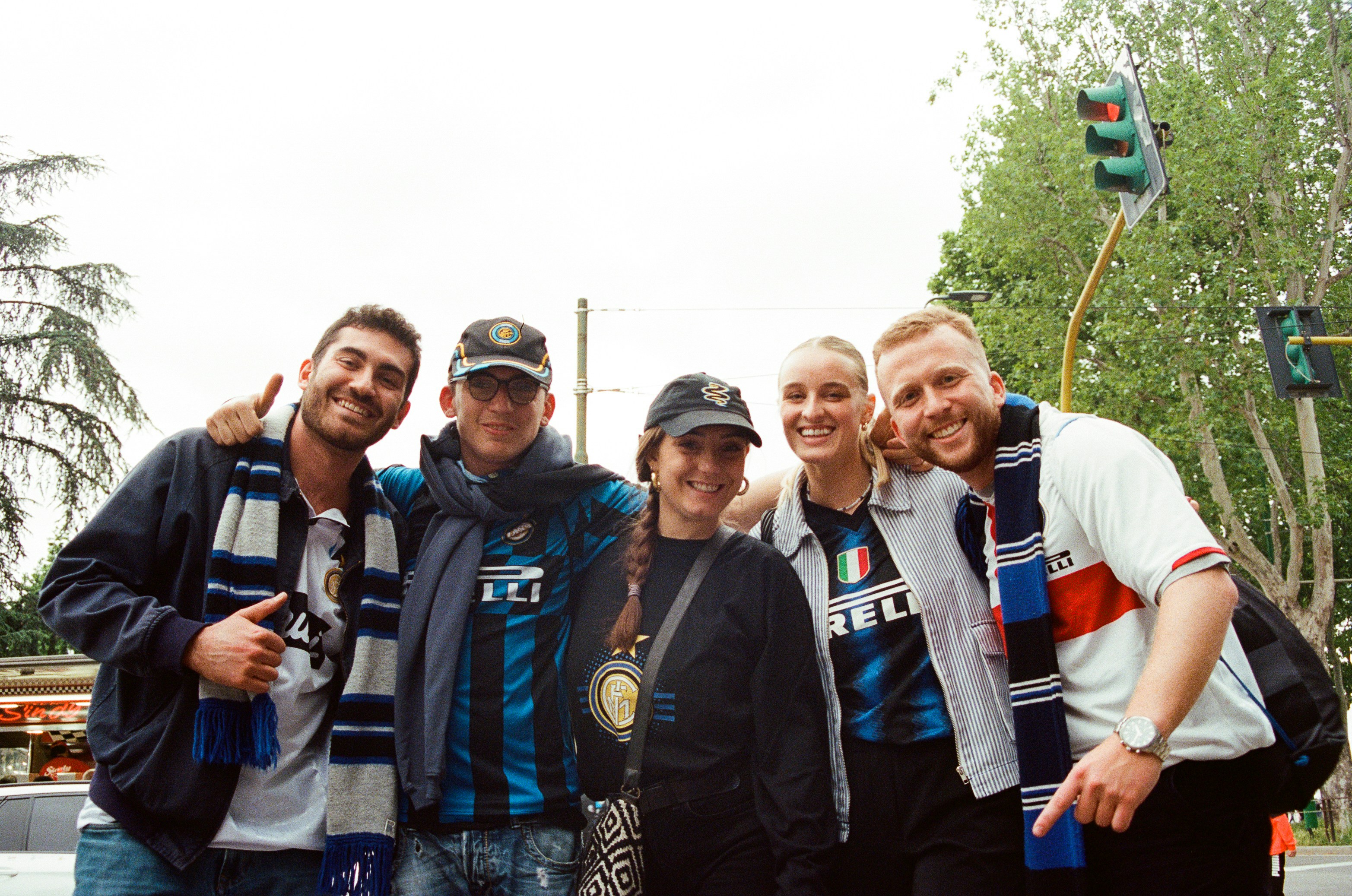 a group of people standing next to each other