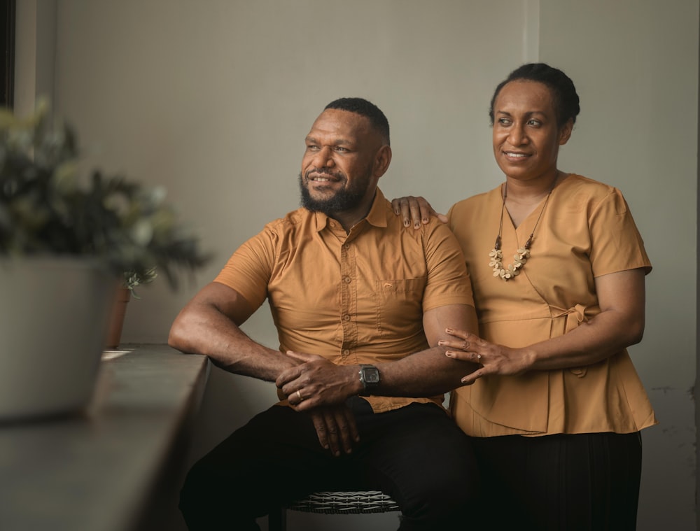 a man and a woman sitting next to each other