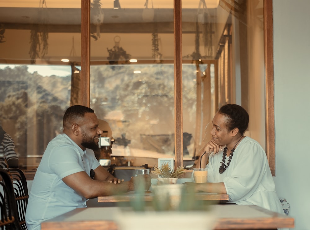 a man and a woman sitting at a table