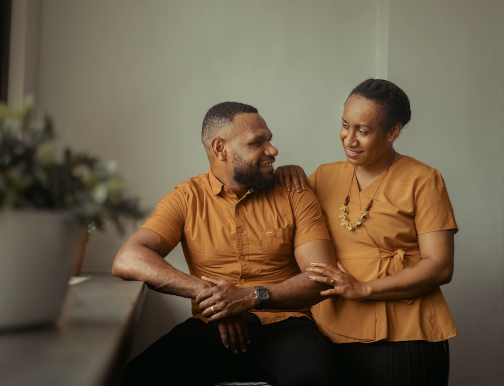 a man and woman sitting next to each other