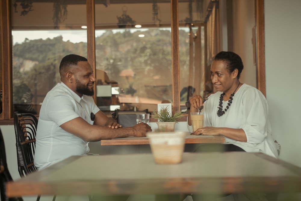 a man and a woman sitting at a table