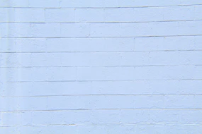 Freshly parged foundation wall with smooth, even finish in natural light.