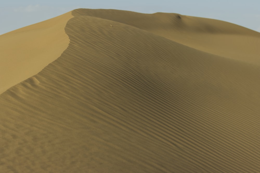 a large sand dune in the middle of a desert