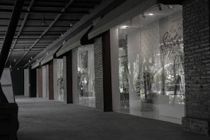 Commercial property storefront with large windows and signage space.