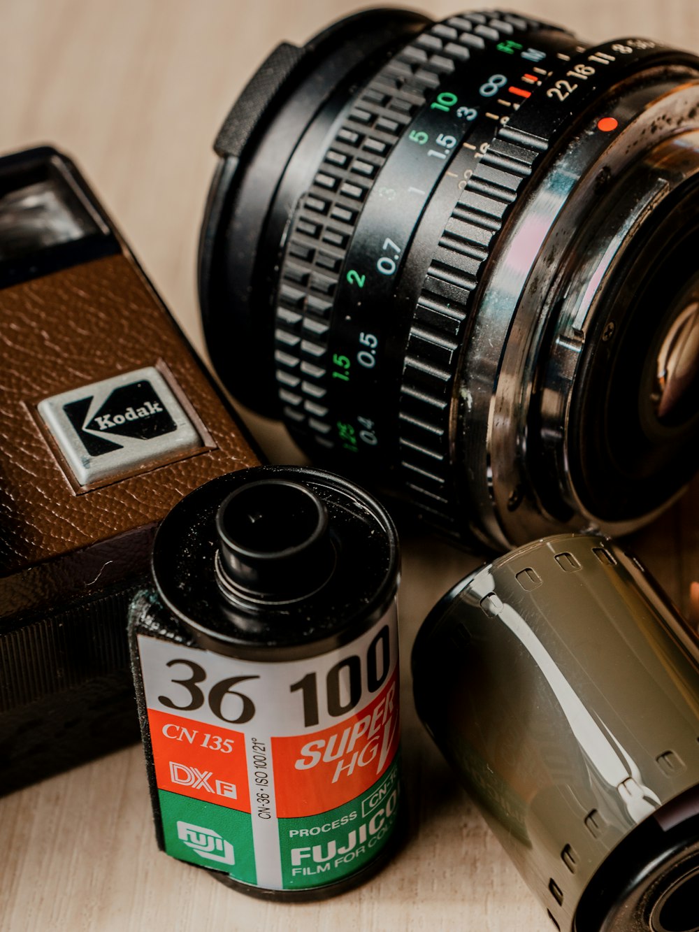 a camera and a lens on a table