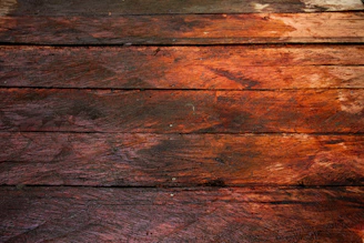 a close up of a piece of wood with peeling paint