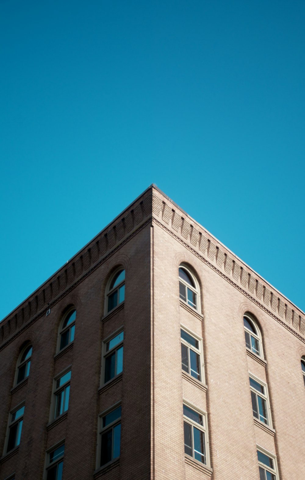 a tall building with lots of windows on top of it