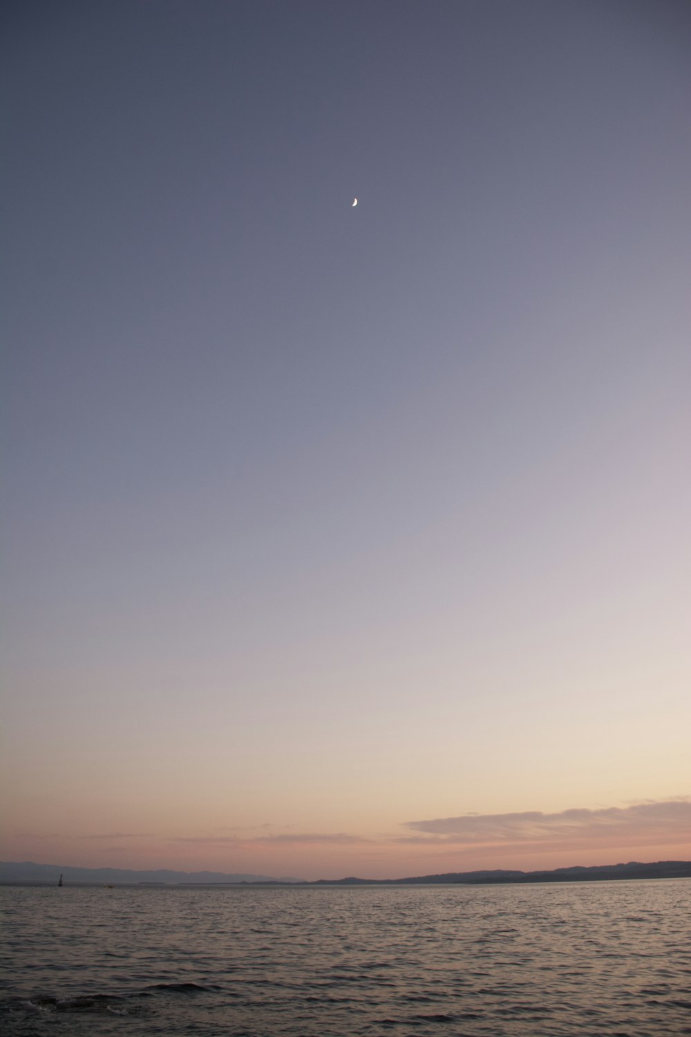 a view of a body of water at sunset