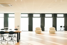 a large room with chairs and tables in it