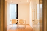 A bright meeting room with large windows and natural light.