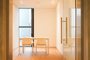 Elegant law office meeting room with natural light and minimalist decor.