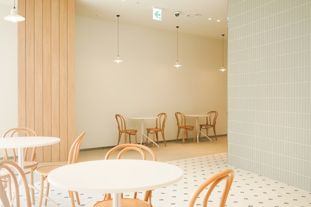 Minimalist modern cafe interior with cozy seating and warm lighting