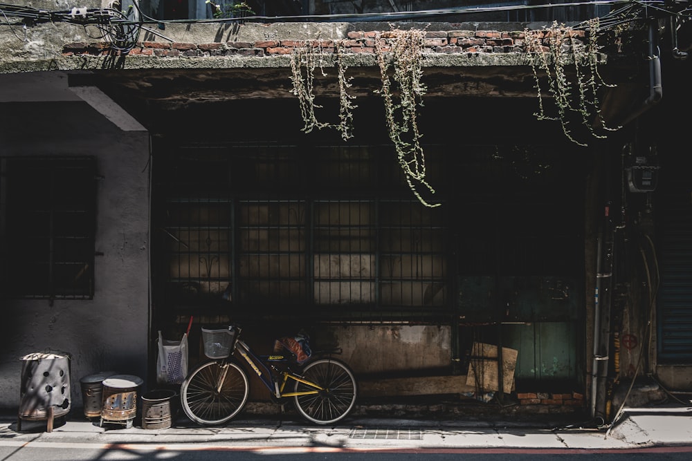 a bicycle parked on the side of a building