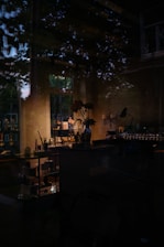 a dimly lit room with a large window