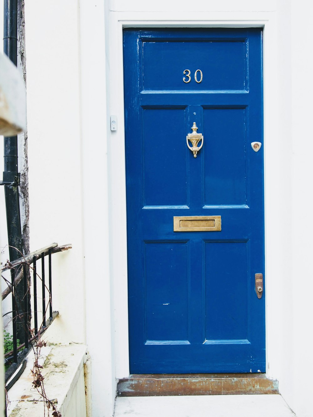 a blue door with a number on it