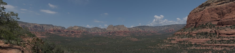 a scenic view of the mountains and trees