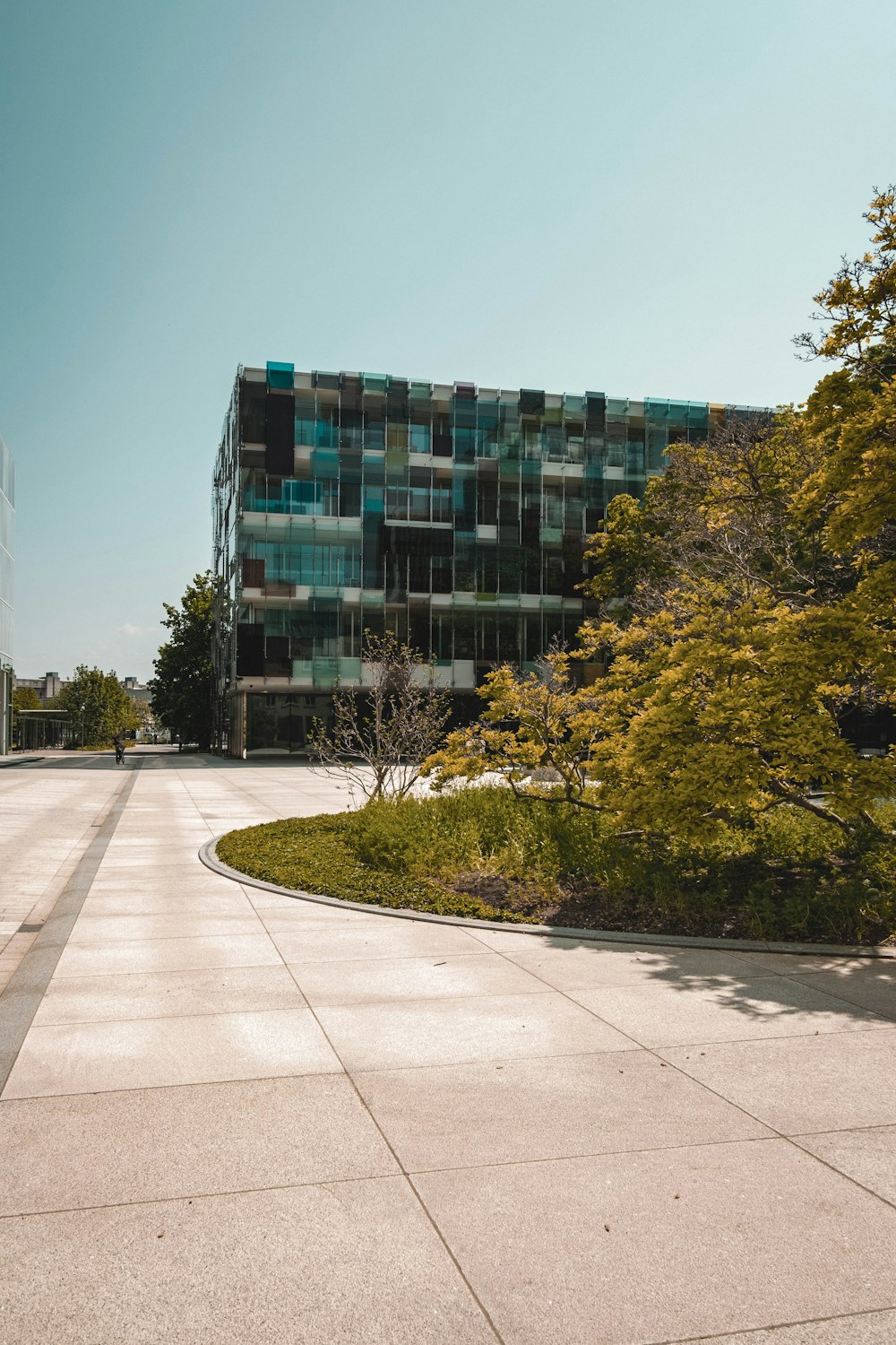 a large building with a curved walkway in front of it