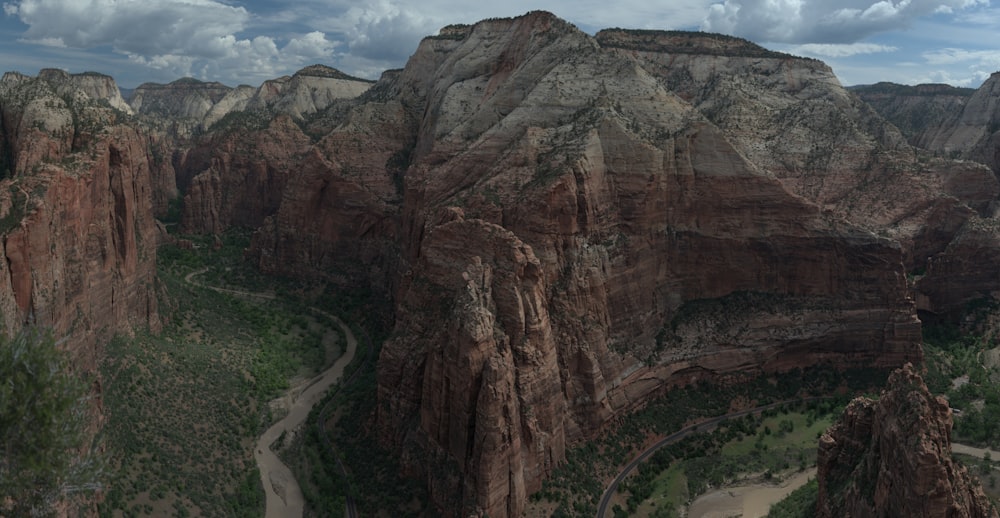 a scenic view of a canyon with a winding road