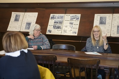 a group of women sitting at a table