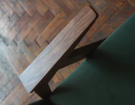 Side-by-side comparison of a stained armchair before and after deep cleaning