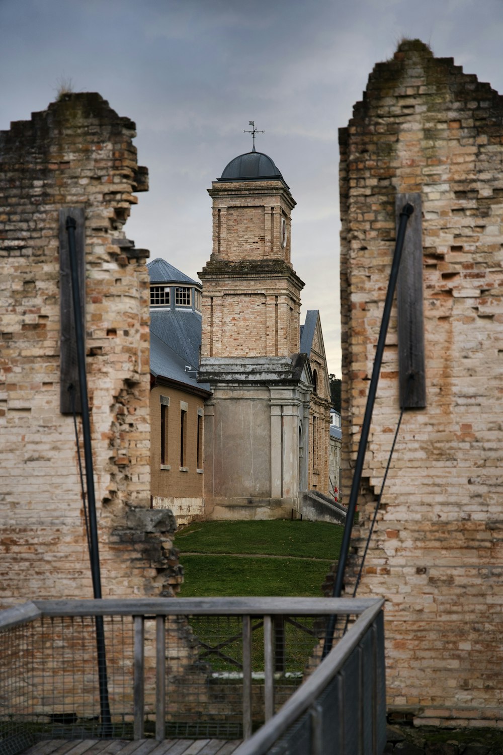 an old building with a clock tower in the background