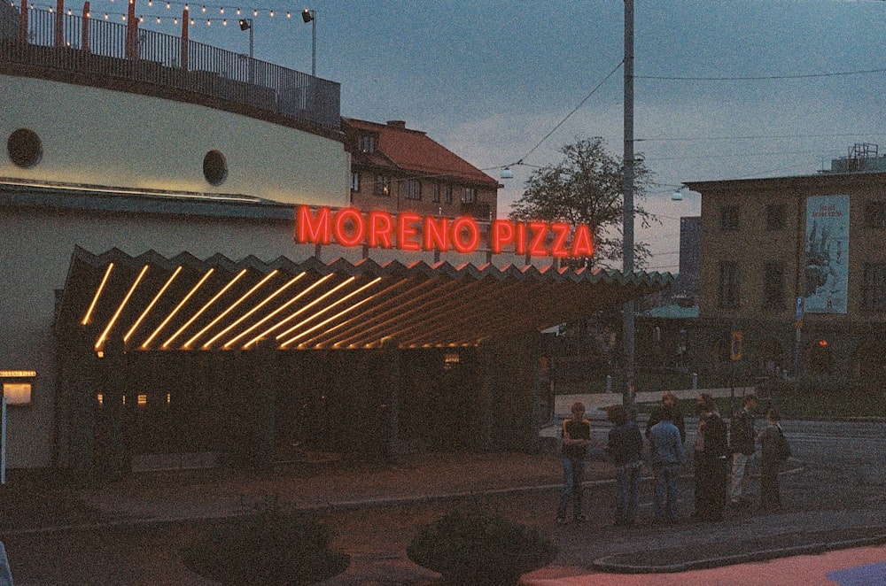 a group of people standing outside of a building