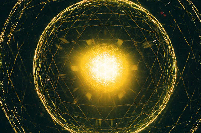 a yellow light is shining in the center of a circular structure
