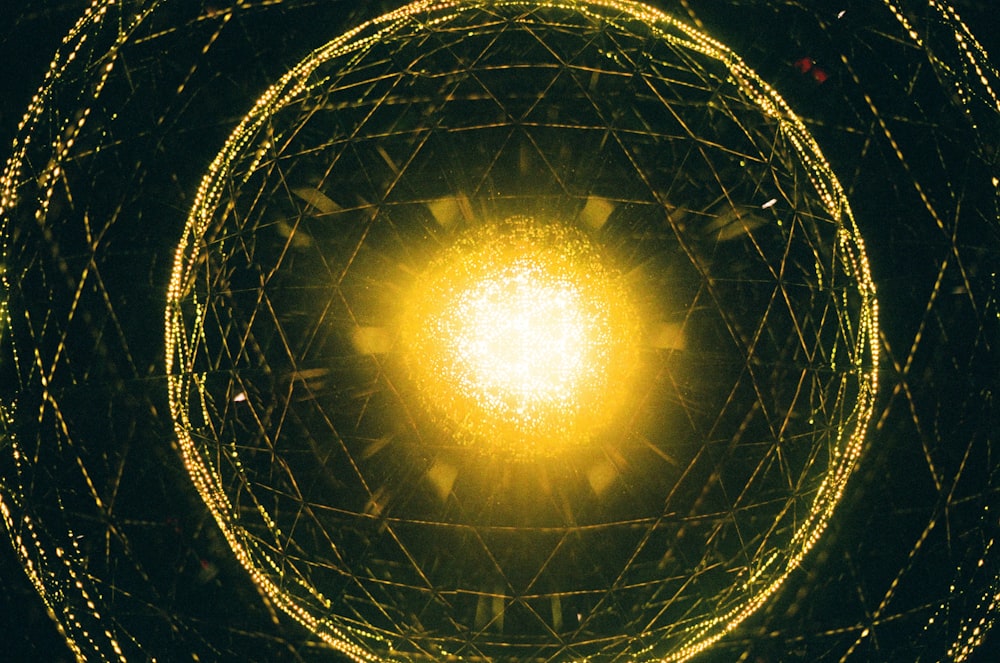 a yellow light is shining in the center of a circular structure