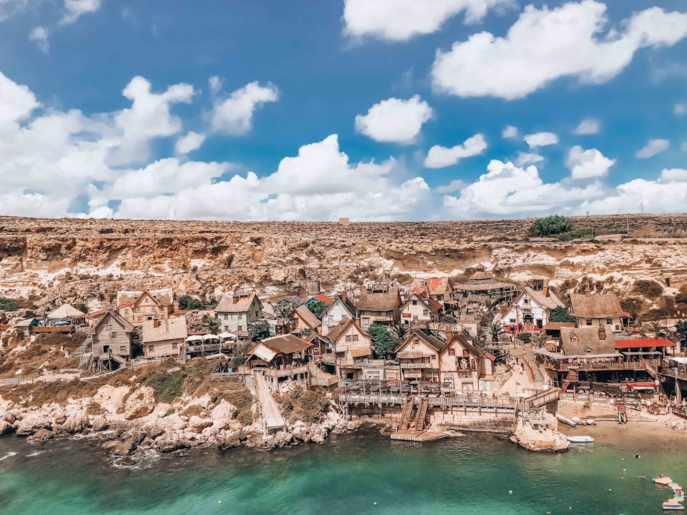 an aerial view of a village on a beach