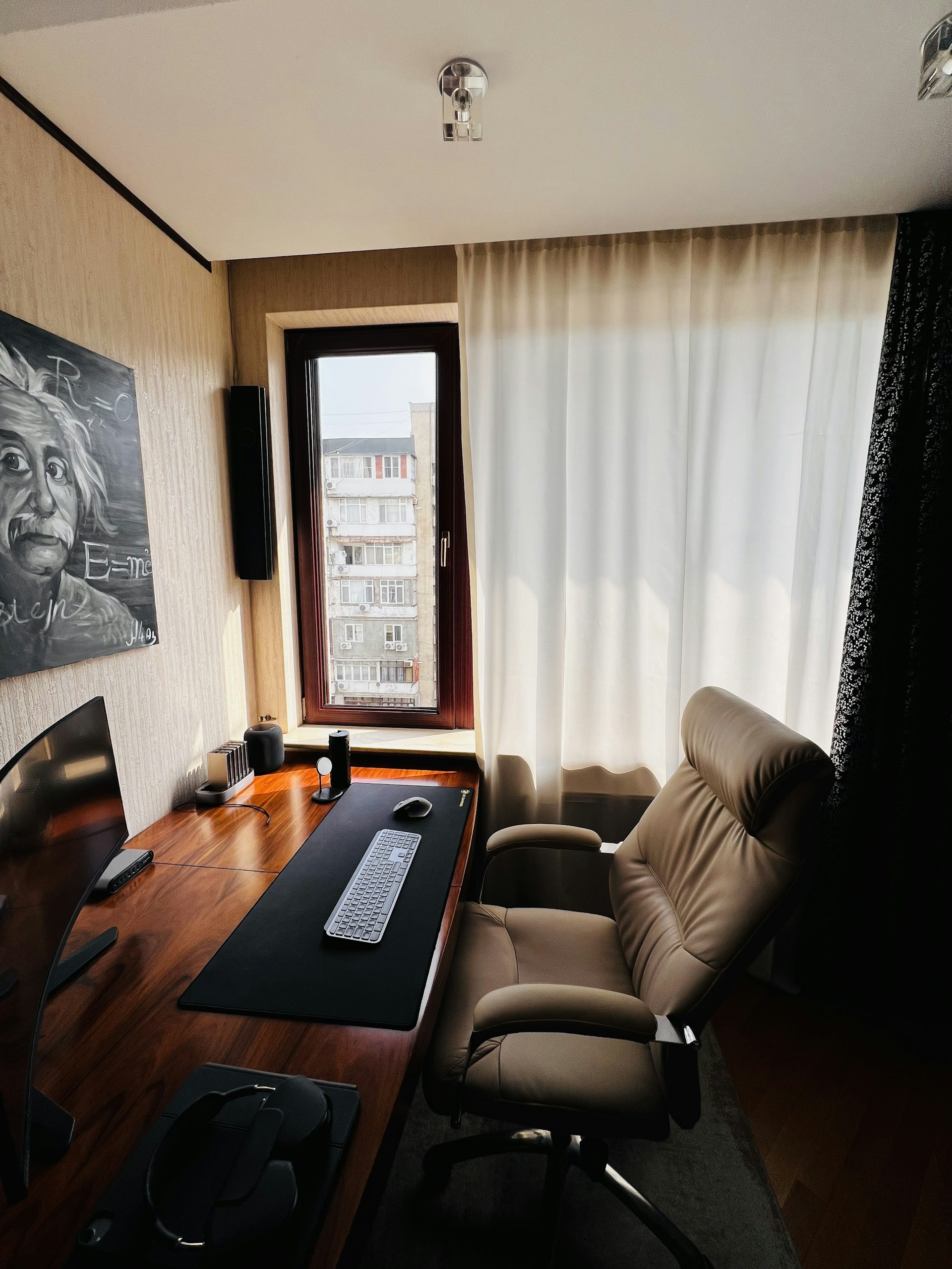 A modern home office setup featuring a sleek desk and stylish decor.