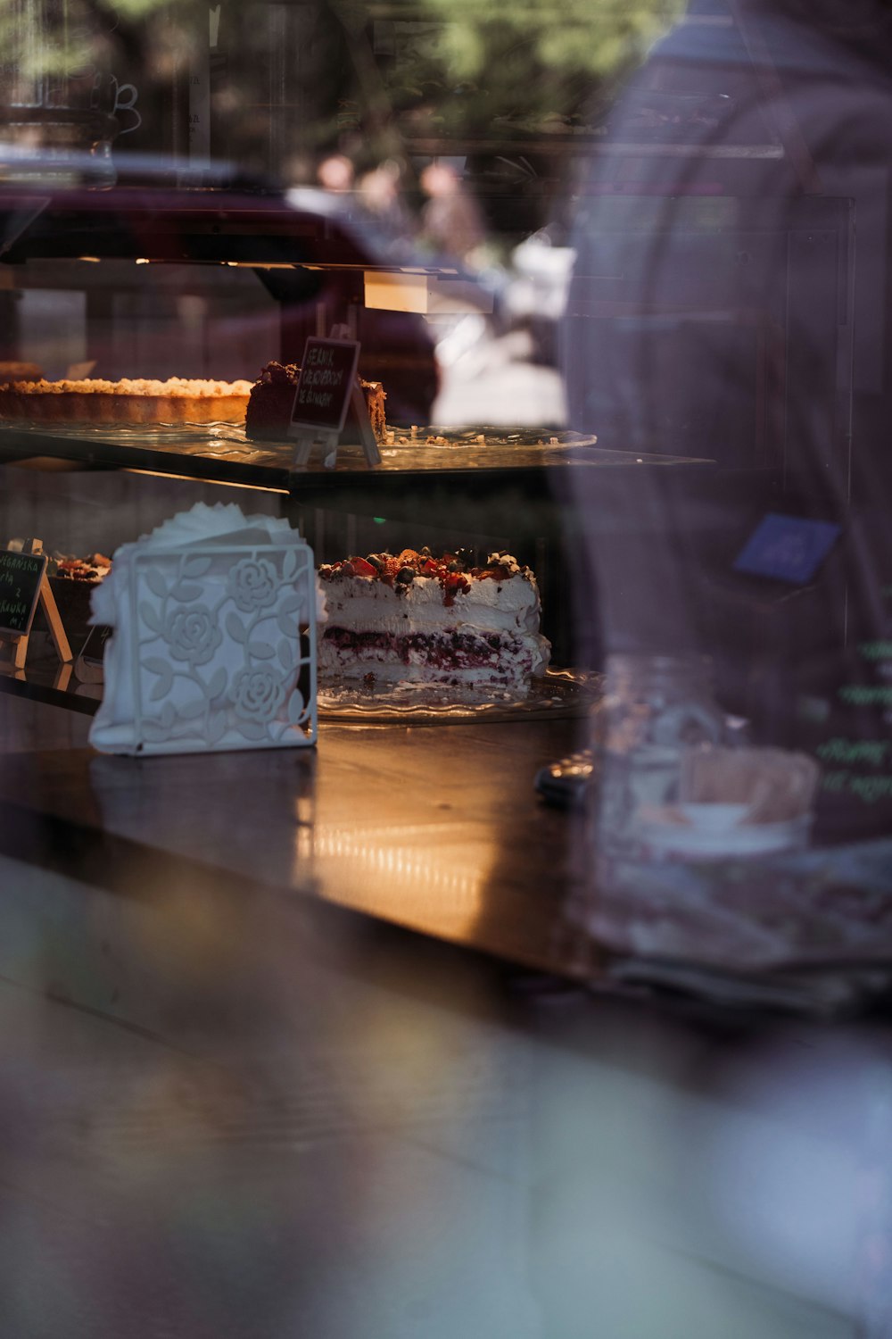 a close up of a cake behind a glass