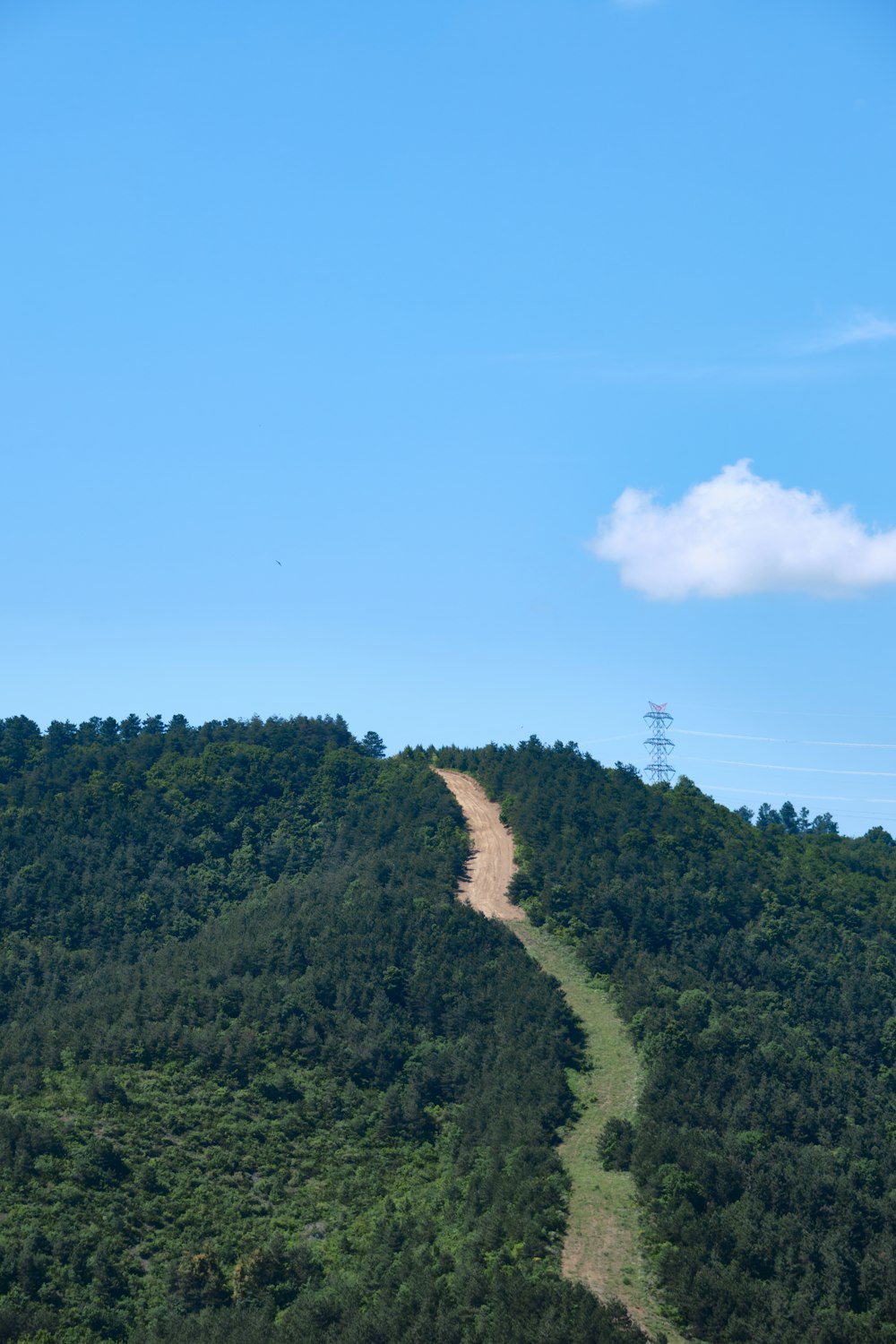 a dirt road going up the side of a mountain