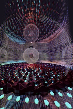 A mesmerizing digital artwork featuring intricate geometric patterns with three large spherical structures at the center. The spheres appear to be composed of thin, transparent meshes surrounded by a vast array of glimmering, faceted elements reminiscent of crystalline forms. The scene is set within a reflective environment that amplifies the complexity and beauty of the design.