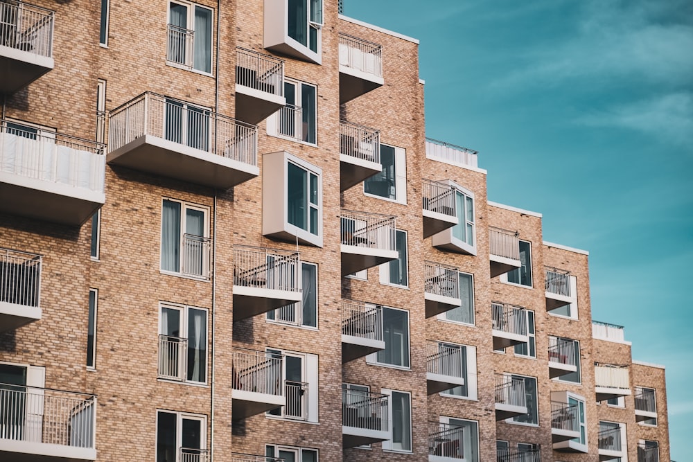 a tall brick building with balconies and balconies