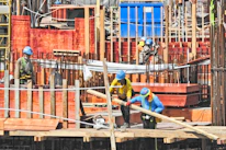 Construction workers using advanced technology tools on-site