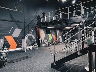 a gym filled with machines and equipment