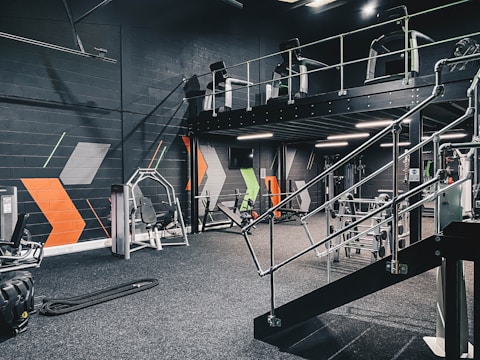 a gym filled with machines and equipment