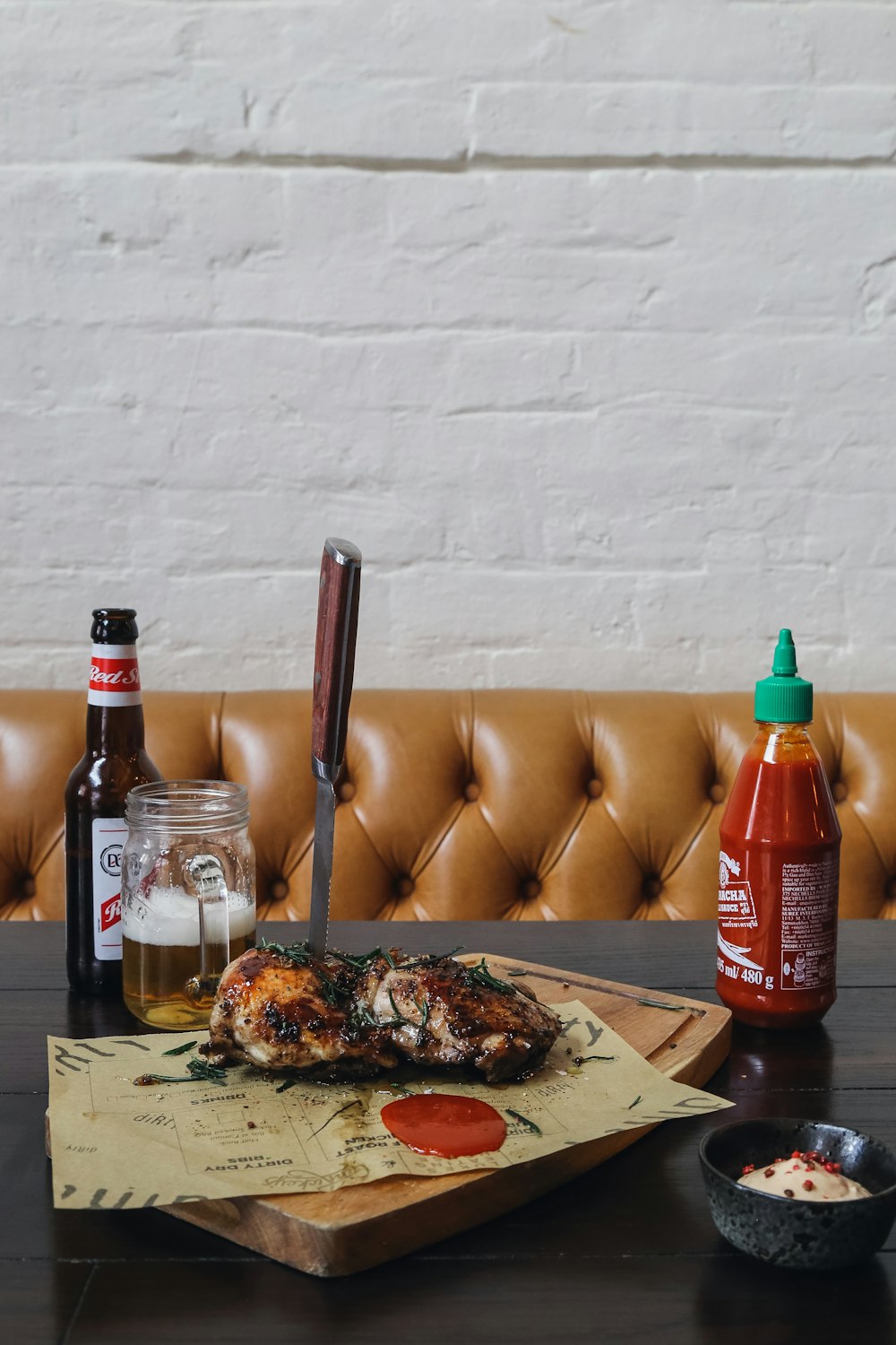 a wooden table topped with a pizza covered in toppings