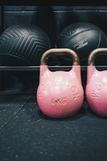 a pair of pink kettles sitting next to each other