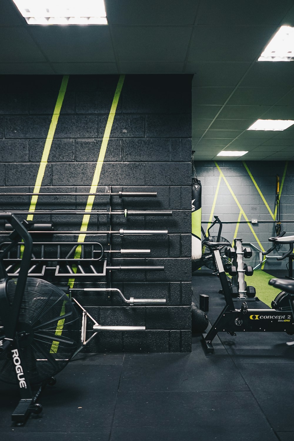 a gym with a row of exercise bikes