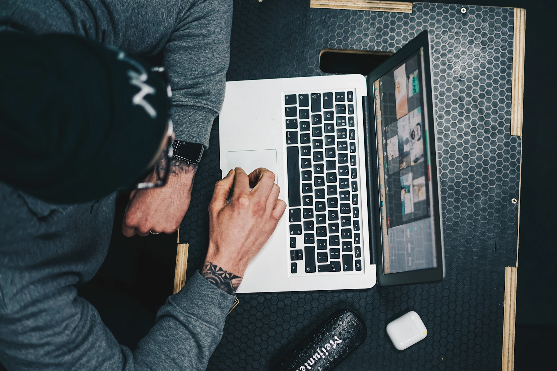 Laptop, notebook, and phone arranged for focused weekly planning